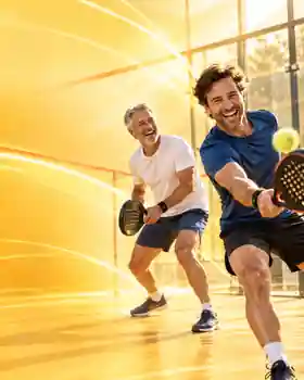 Two adults enjoying padel together on an outdoor court